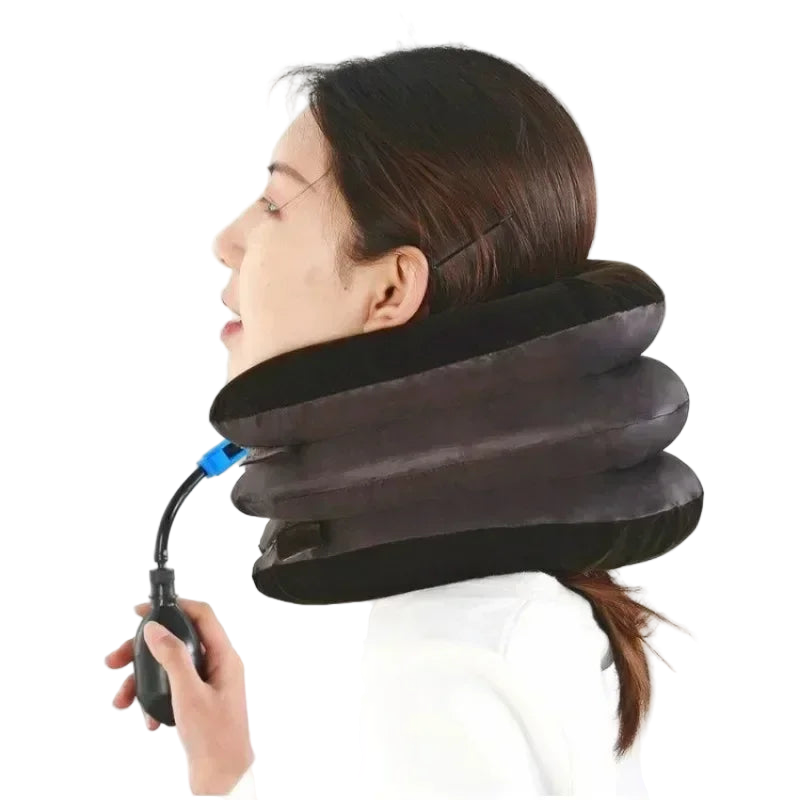 Person using an inflatable neck pillow with a hand pump on a white background