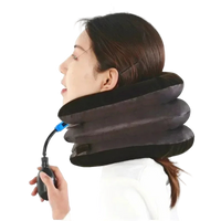 Person using an inflatable neck pillow with a hand pump on a white background
